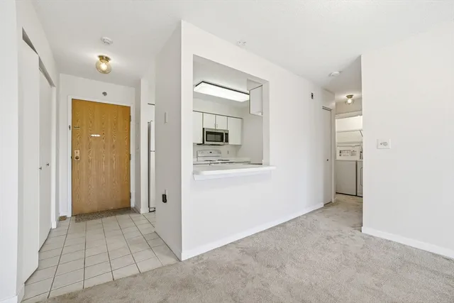 a kitchen with a sink and a refrigerator