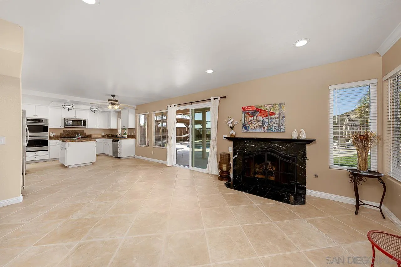 13558 Quiet Hills Drive Poway, CA 92064 - Photo 16 of 61 a living room with furniture and a fireplace