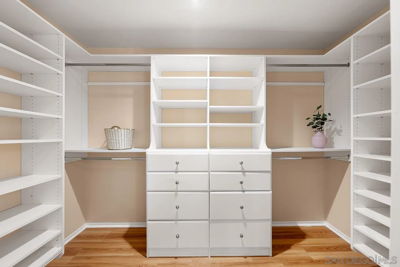 13558 Quiet Hills Drive Poway, CA 92064 - Photo 33 of 61 a view of walk in closet with empty racks