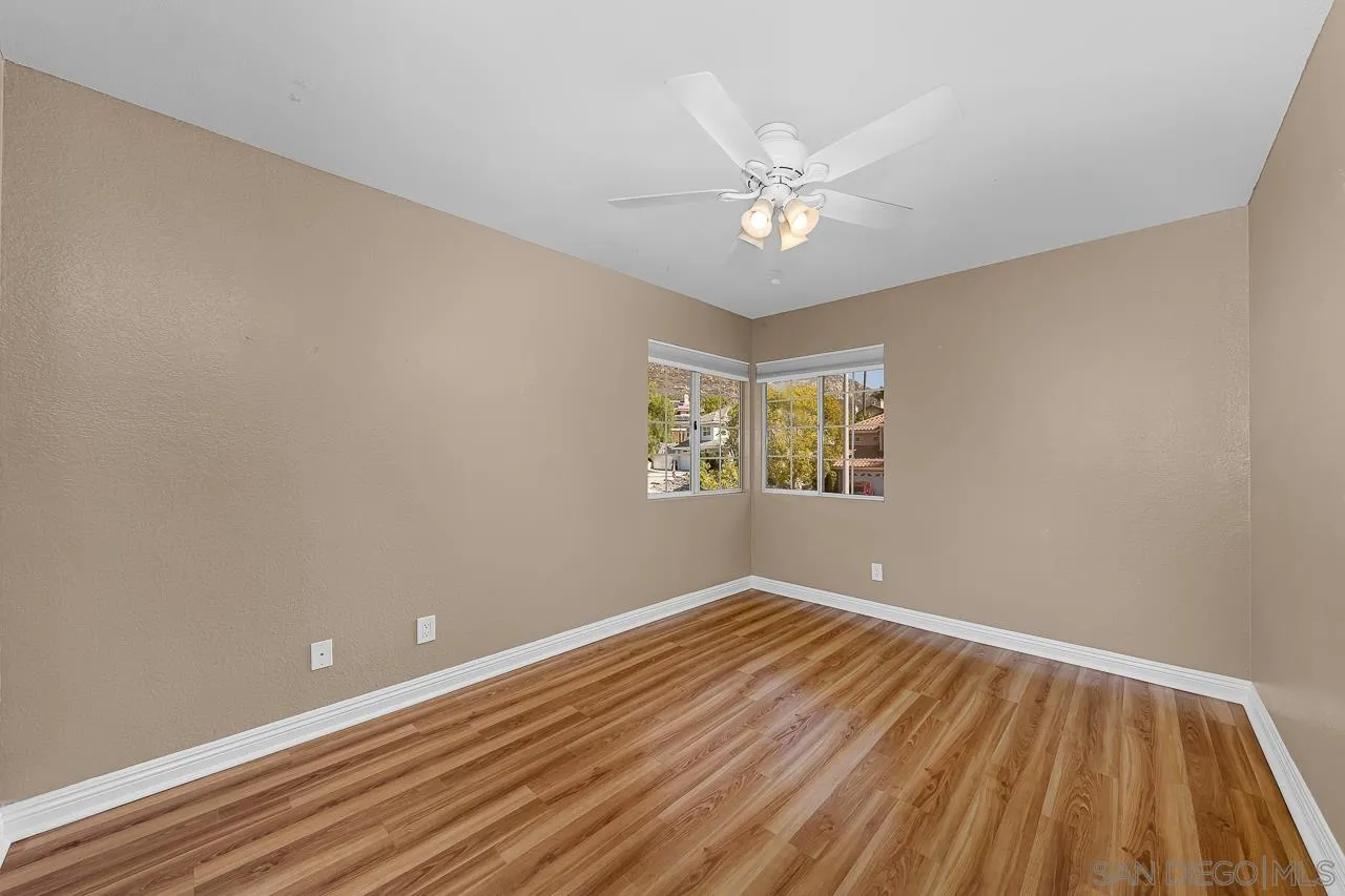 13558 Quiet Hills Drive Poway, CA 92064 - Photo 38 of 61 wooden floor in an empty room with a window