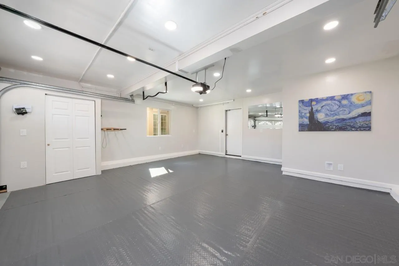13558 Quiet Hills Drive Poway, CA 92064 - Photo 45 of 61 an empty room with wooden floor and windows