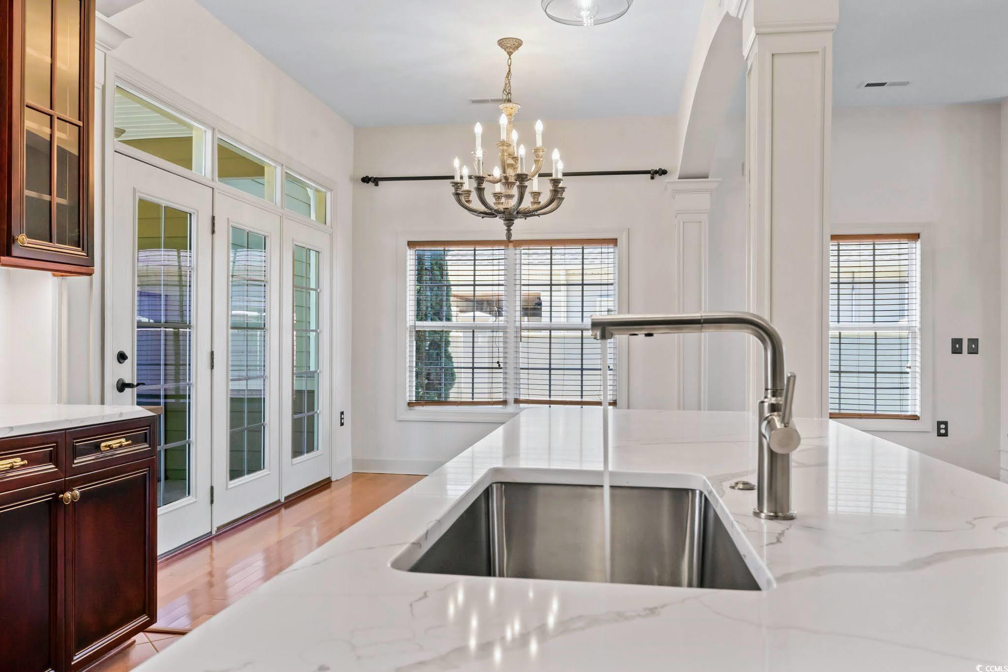 853 Bluffview Drive Myrtle Beach, SC 29579 - Photo 13 of 40 Kitchen with light stone counters, a sink, visible