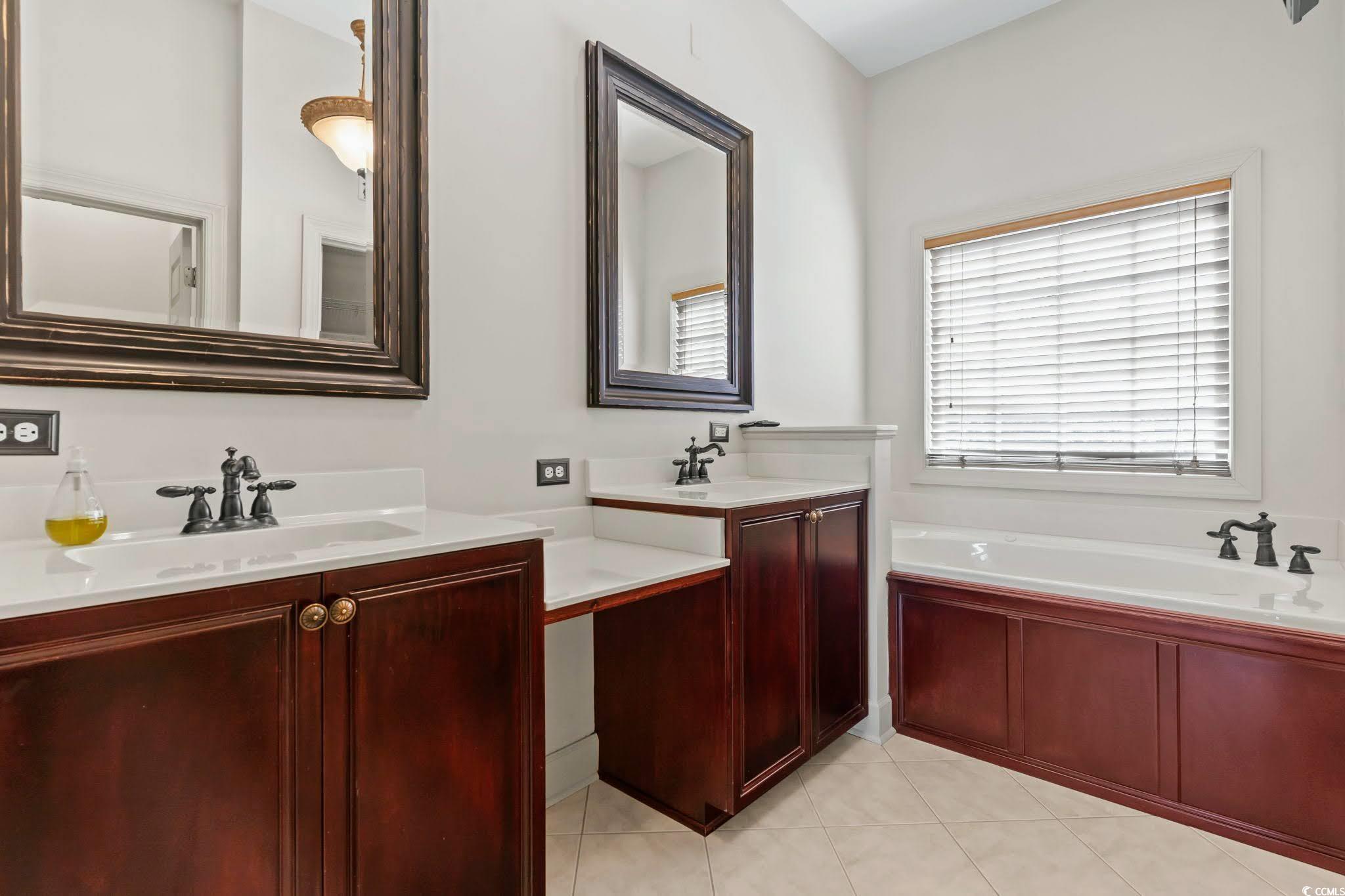 853 Bluffview Drive Myrtle Beach, SC 29579 - Photo 22 of 40 Full bath featuring a sink, two vanities, tile pat
