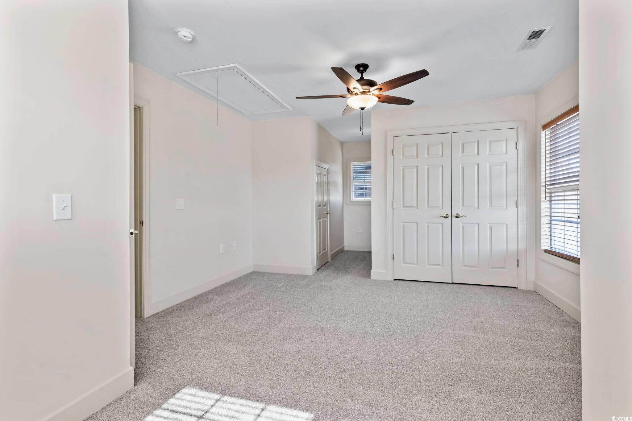 853 Bluffview Drive Myrtle Beach, SC 29579 - Photo 27 of 40 Unfurnished bedroom featuring attic access, visibl