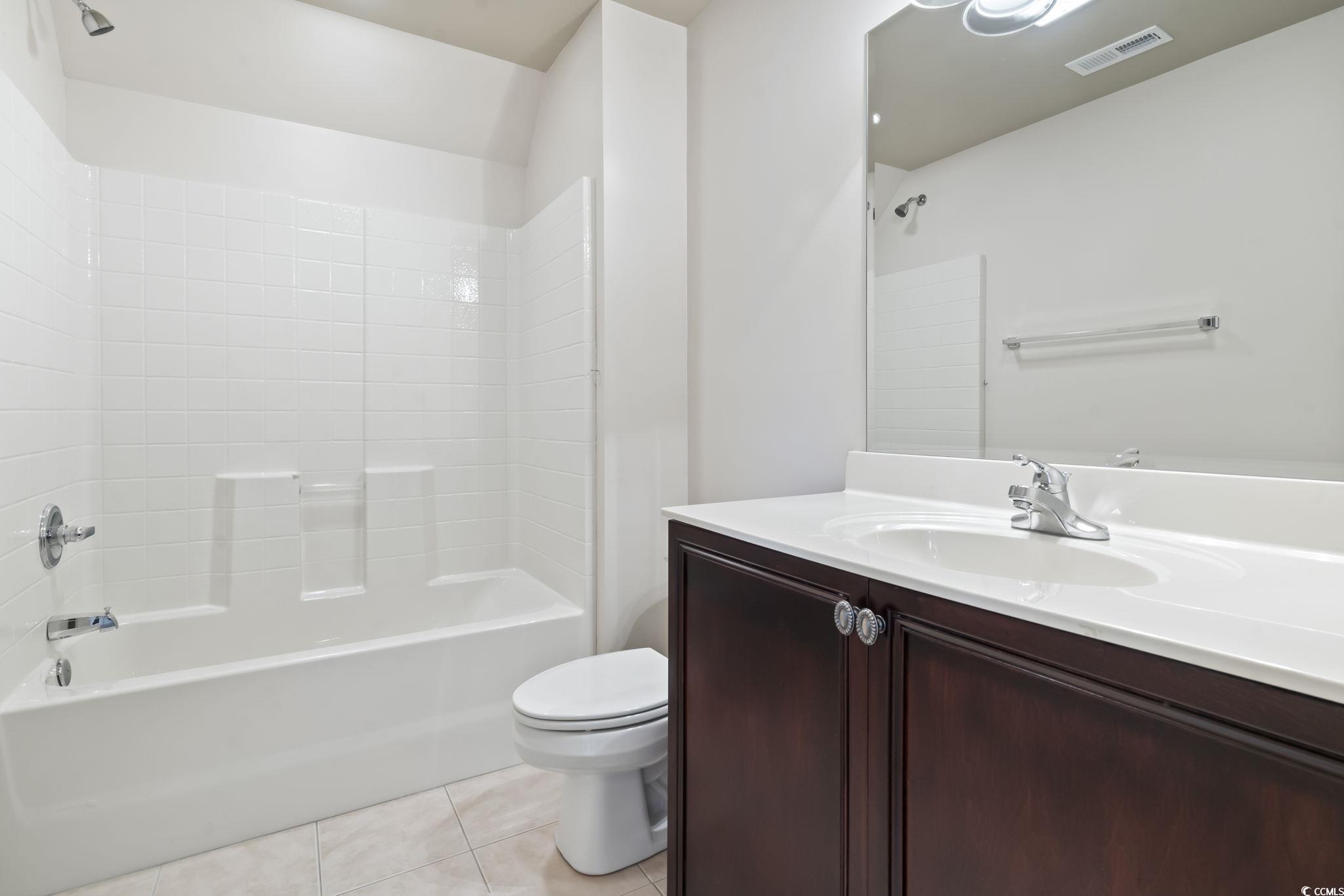 853 Bluffview Drive Myrtle Beach, SC 29579 - Photo 28 of 40 Full bathroom with vanity, tile patterned floors,