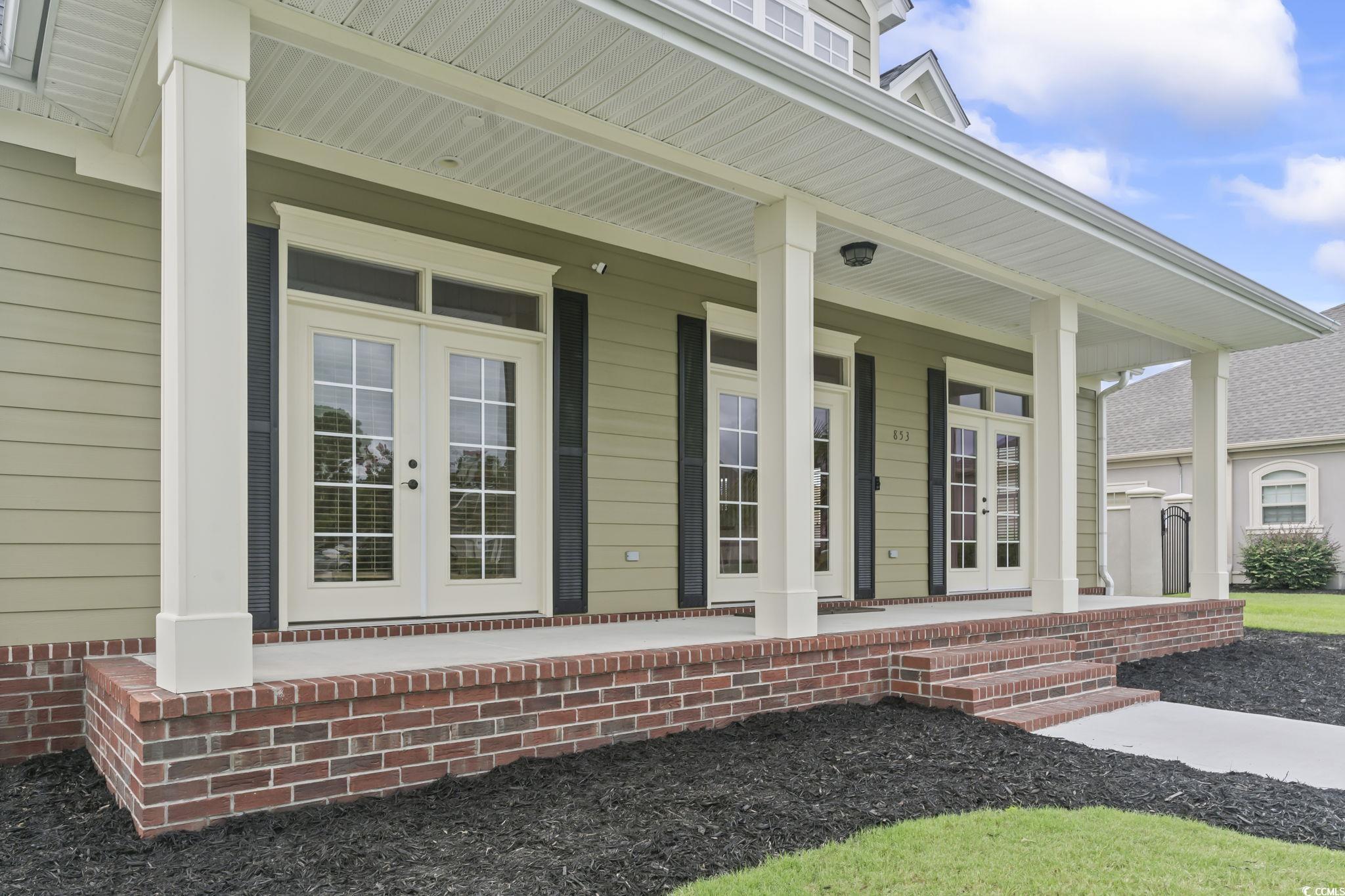 853 Bluffview Drive Myrtle Beach, SC 29579 - Photo 32 of 40 Property entrance with french doors and covered po