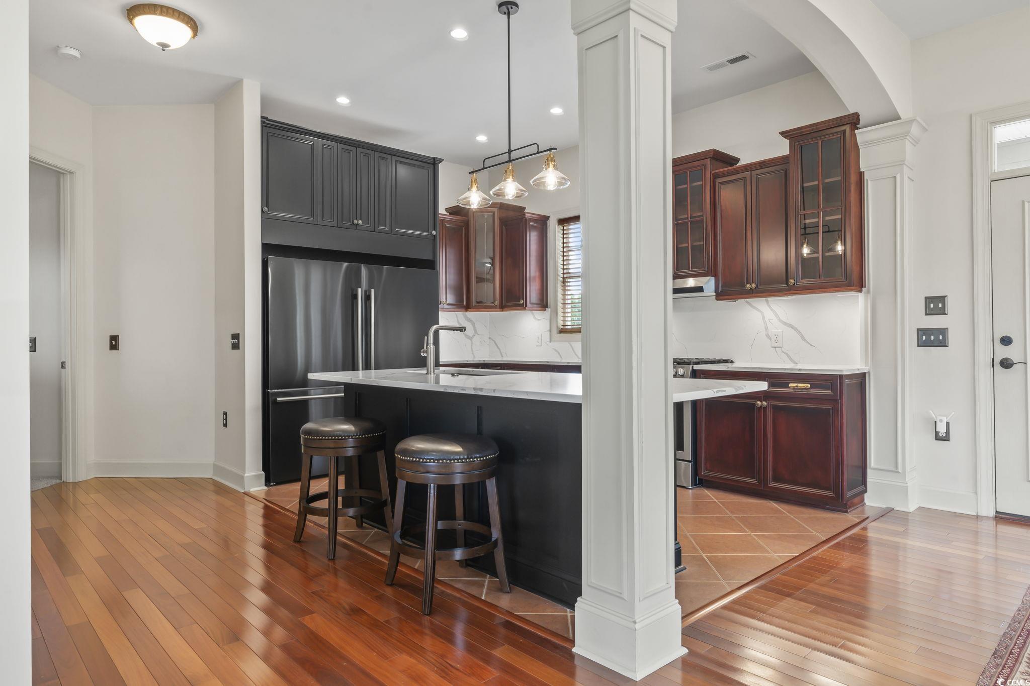 853 Bluffview Drive Myrtle Beach, SC 29579 - Photo 6 of 40 Kitchen featuring high end refrigerator, light cou