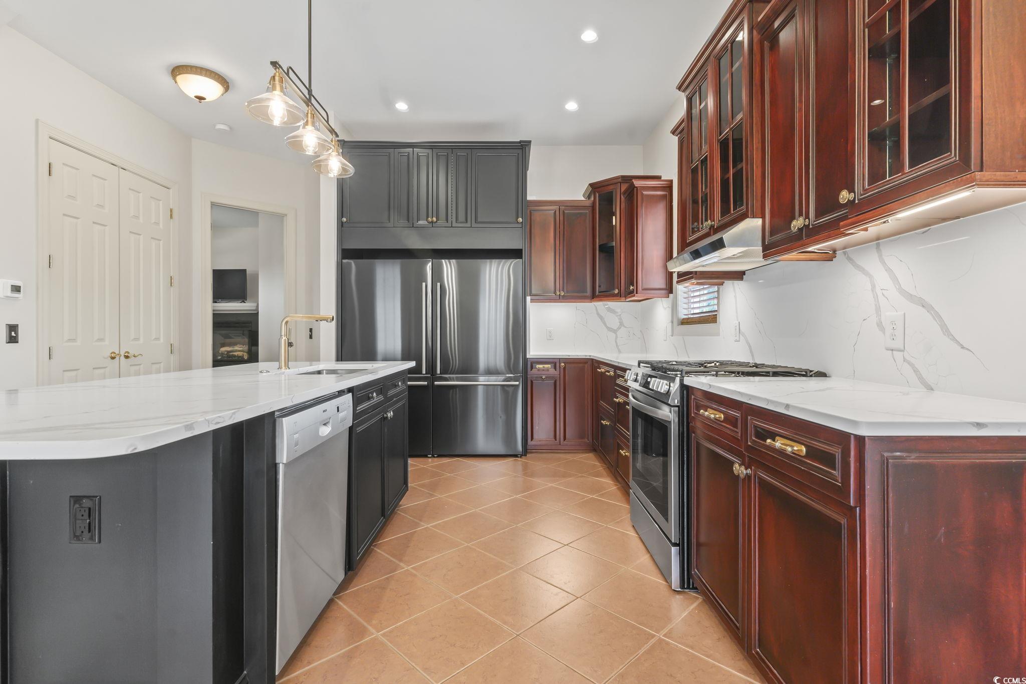 853 Bluffview Drive Myrtle Beach, SC 29579 - Photo 7 of 40 Kitchen featuring stainless steel appliances, a si