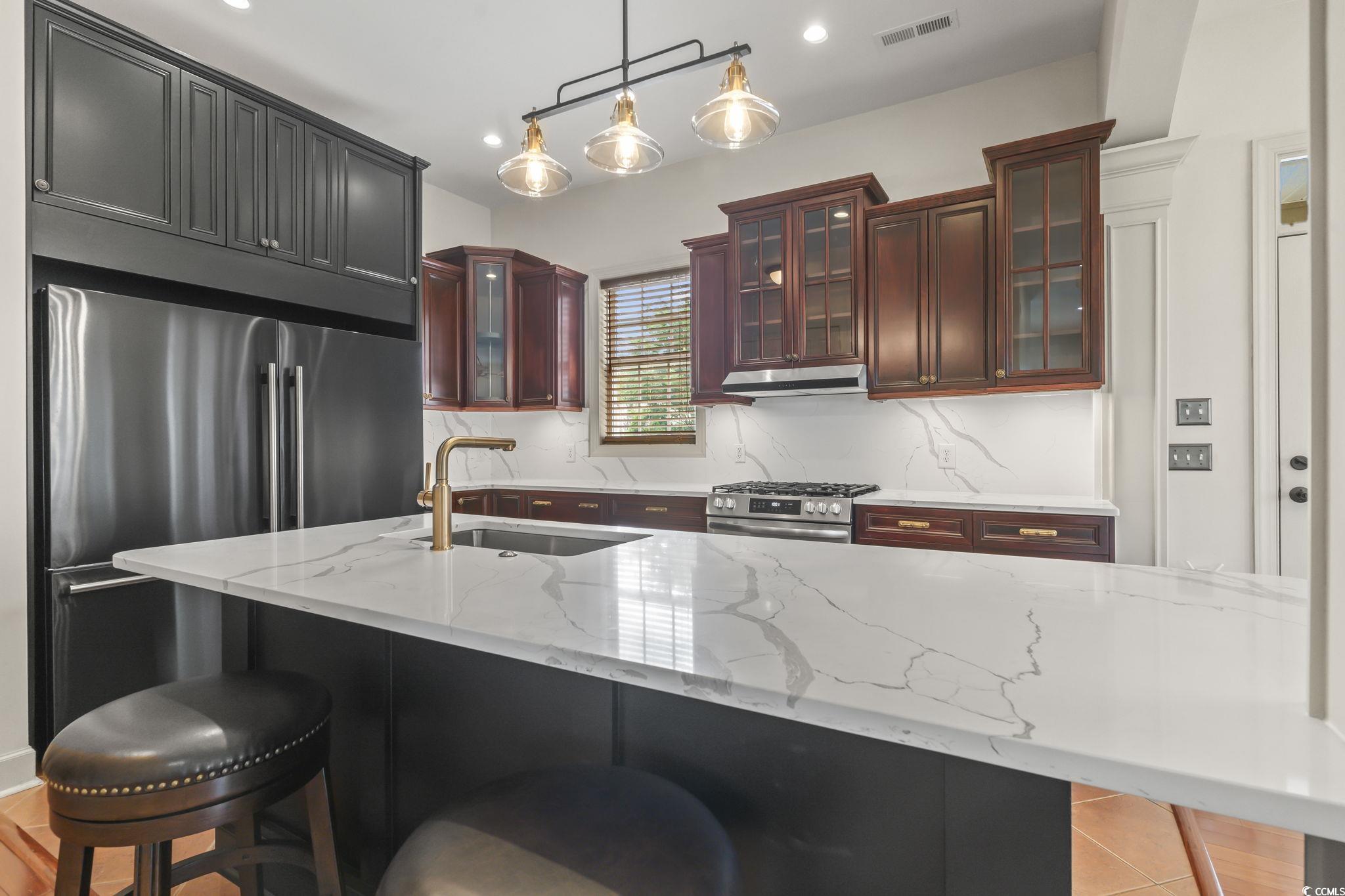 853 Bluffview Drive Myrtle Beach, SC 29579 - Photo 8 of 40 Kitchen featuring a sink, appliances with stainles