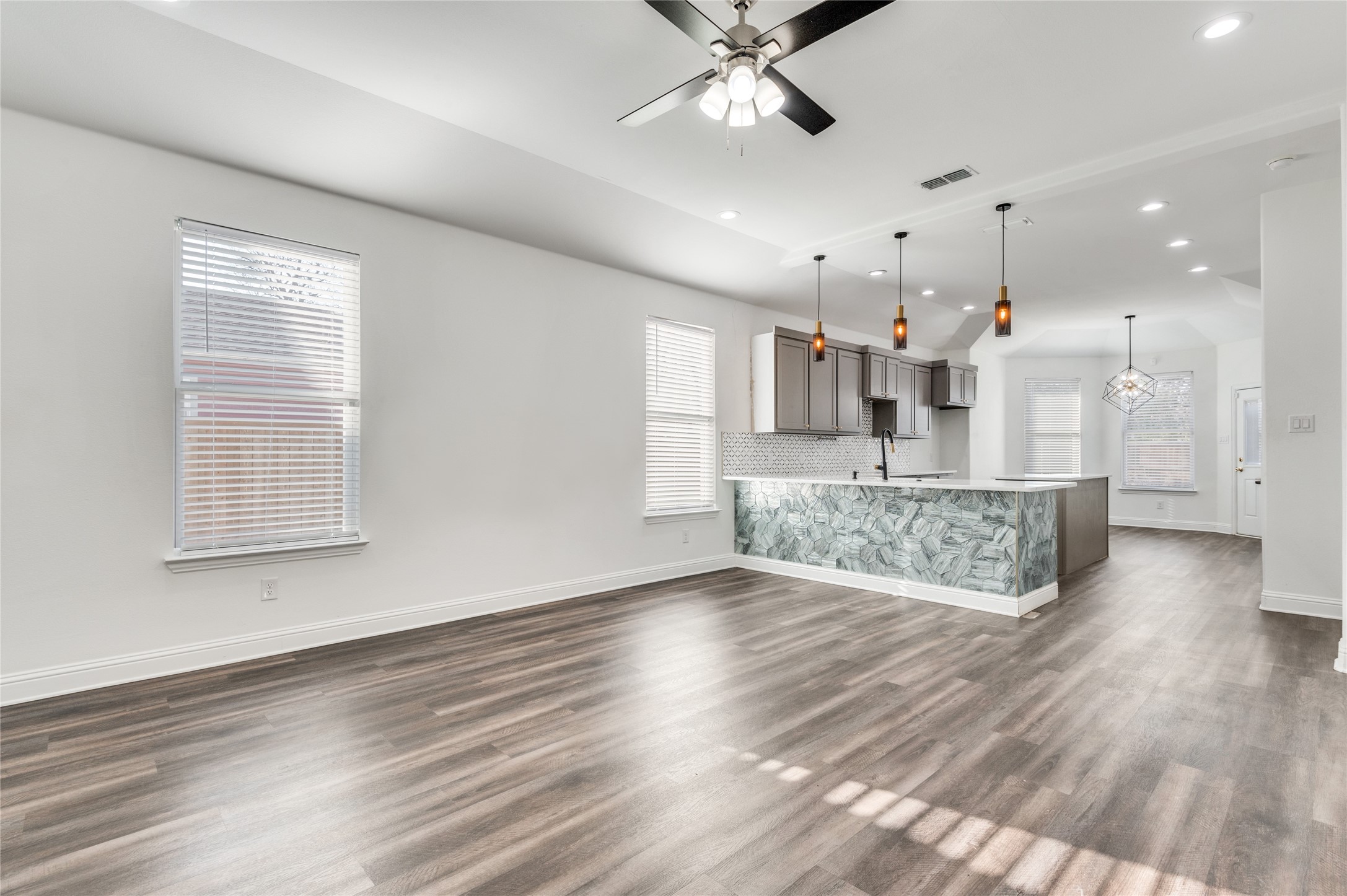 2255 Exeter Avenue Dallas, TX 75216 - Photo 13 of 30 a view of kitchen and hall with wooden floor