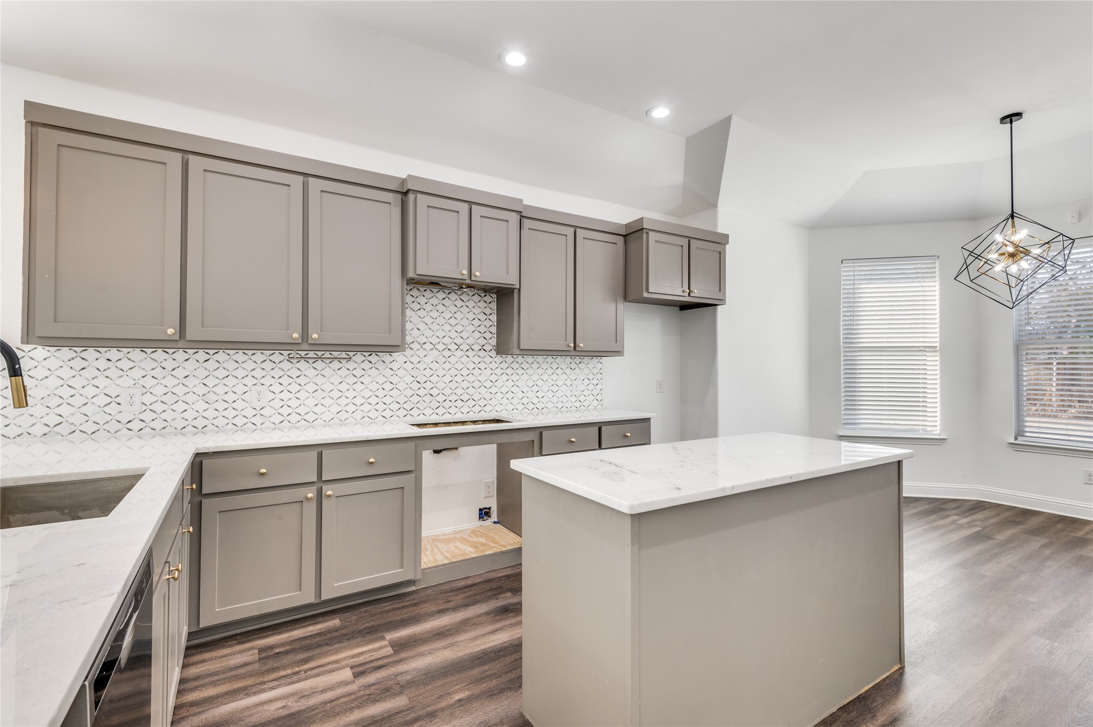 2255 Exeter Avenue Dallas, TX 75216 - Photo 15 of 30 a kitchen with stainless steel appliances white cabinets and sink