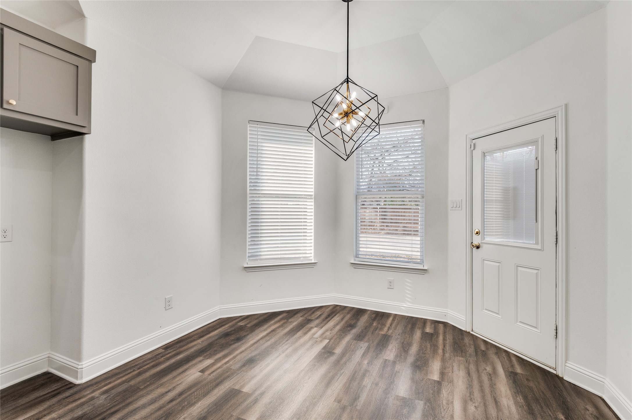 2255 Exeter Avenue Dallas, TX 75216 - Photo 16 of 30 a view of an empty room with wooden floor and a window
