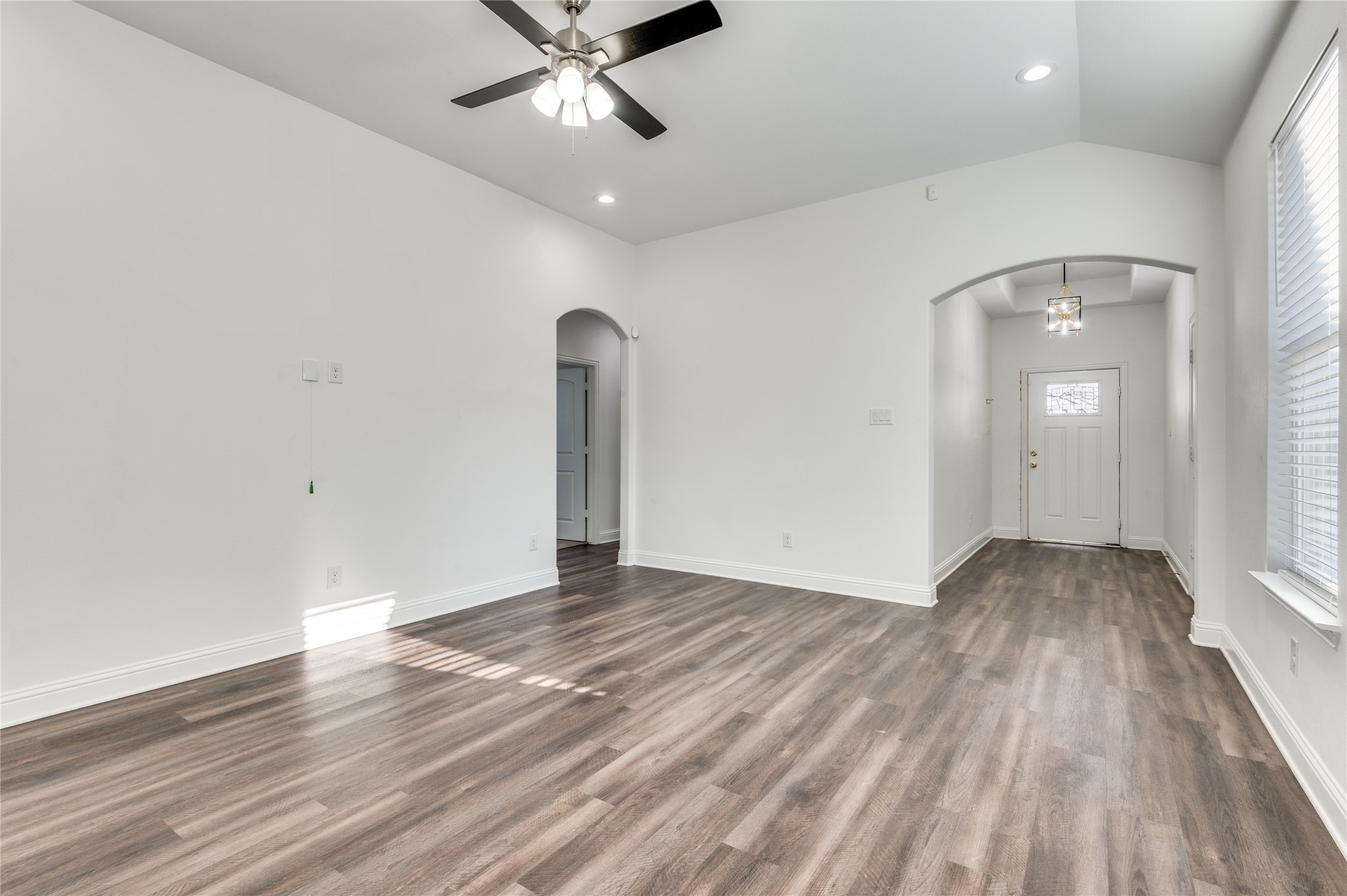 2255 Exeter Avenue Dallas, TX 75216 - Photo 2 of 30 wooden floor in an empty room with a window