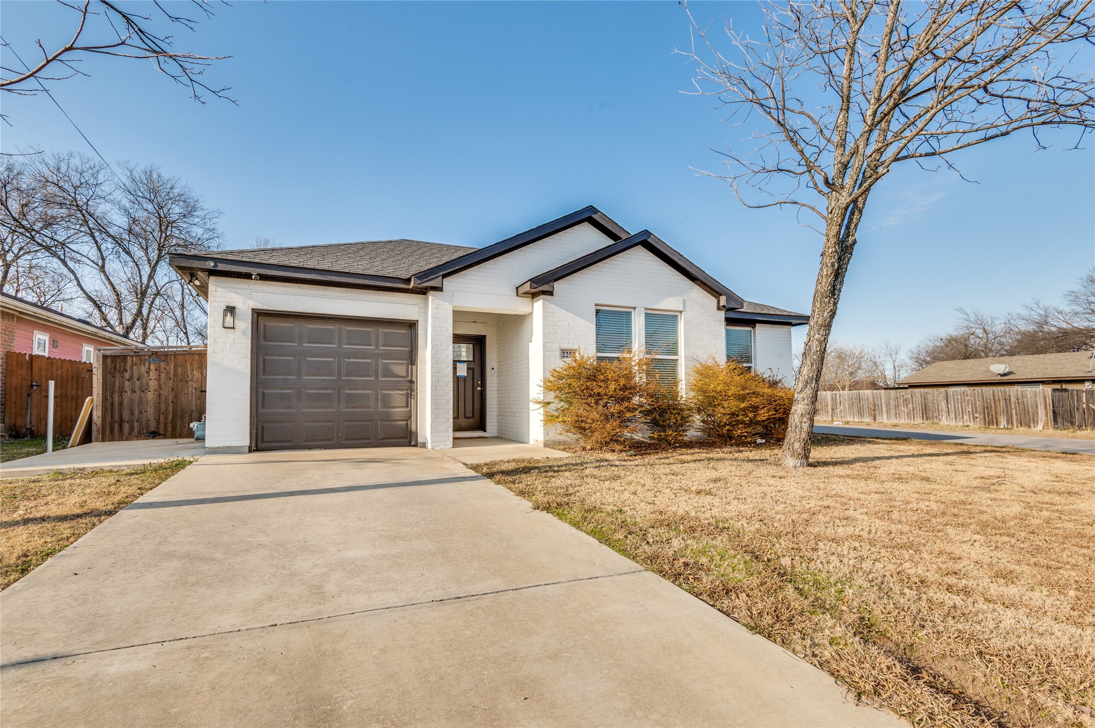 2255 Exeter Avenue Dallas, TX 75216 - Photo 6 of 30 a front view of a house with yard and garage