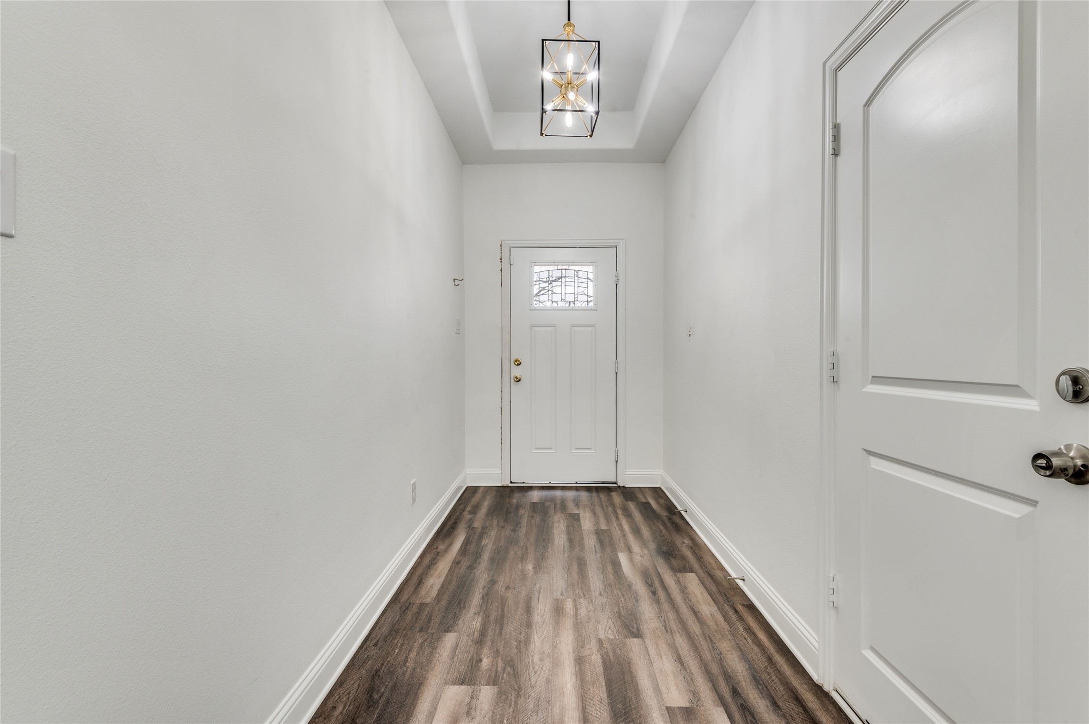 2255 Exeter Avenue Dallas, TX 75216 - Photo 7 of 30 a view of a hallway with wooden floor