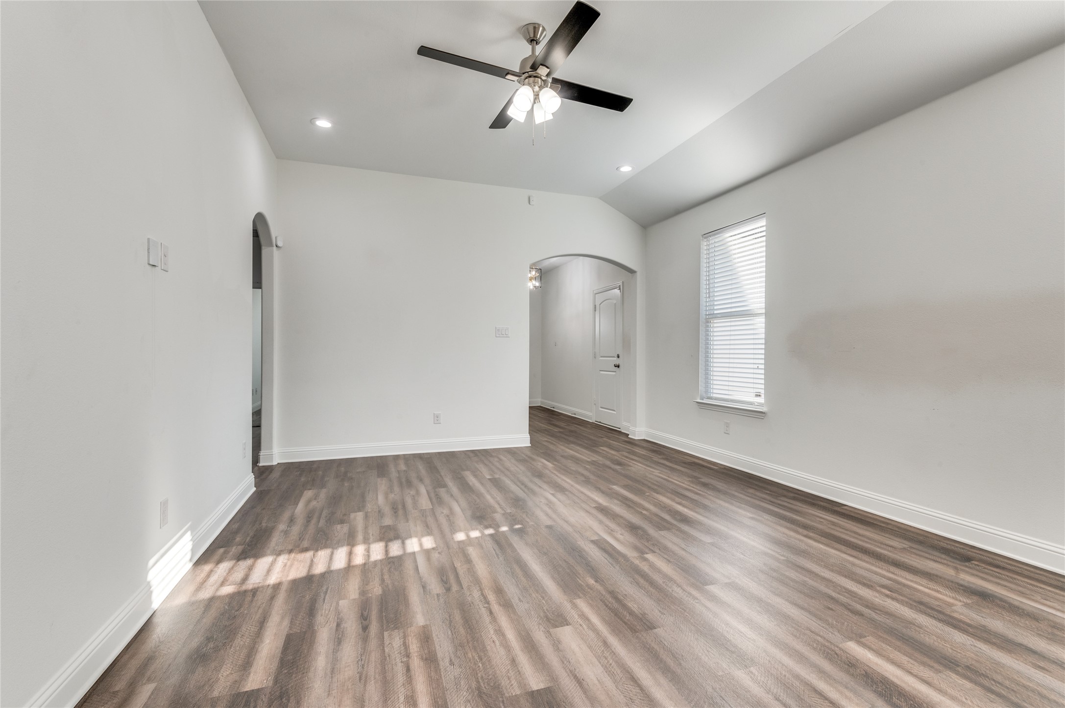 2255 Exeter Avenue Dallas, TX 75216 - Photo 10 of 30 a view of empty room with wooden floor and fan