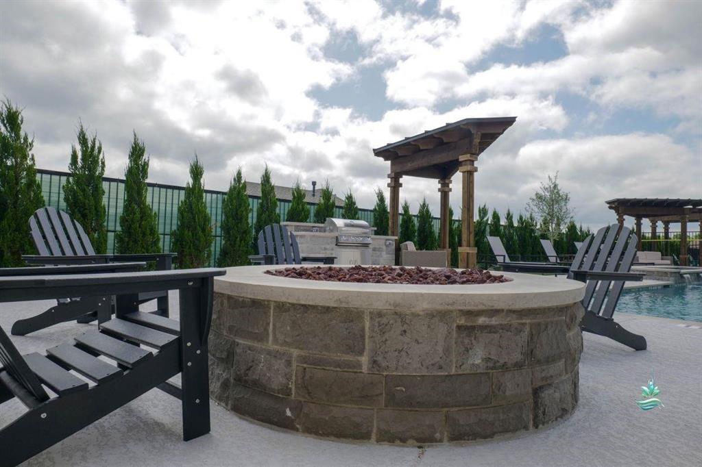 217 Raveena Boulevard Justin, TX 76247 - Photo 5 of 7 a view of a swimming pool with a patio