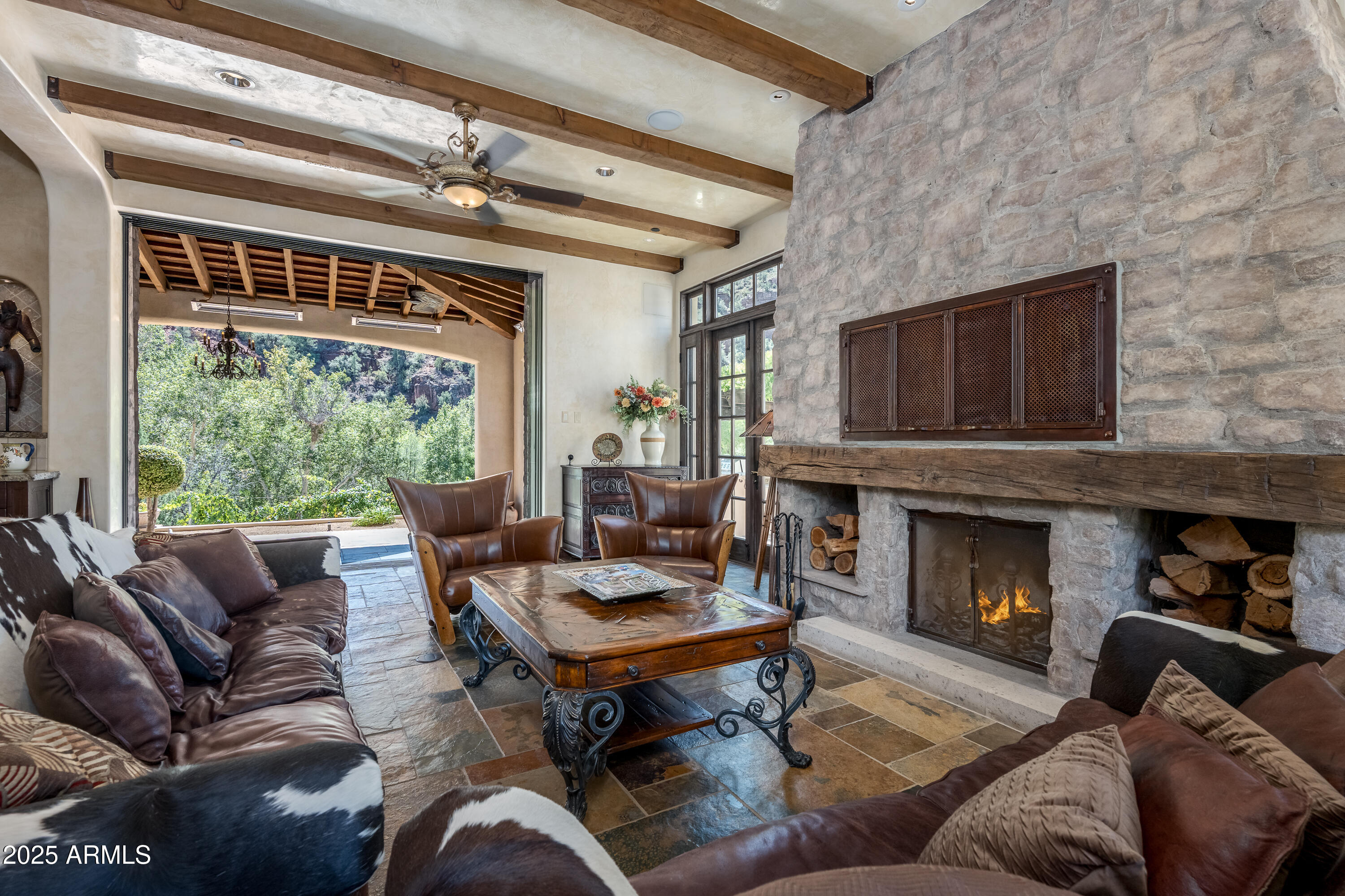 330 Eagle Mountain Ranch Road Sedona, AZ 86336 - Photo 14 of 87 a living room with furniture fireplace and a large window