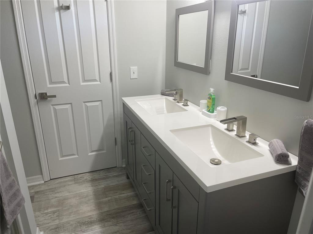 21 Post View Drive Palm Coast, FL 32164 - Photo 12 of 28 a bathroom with a sink and a mirror