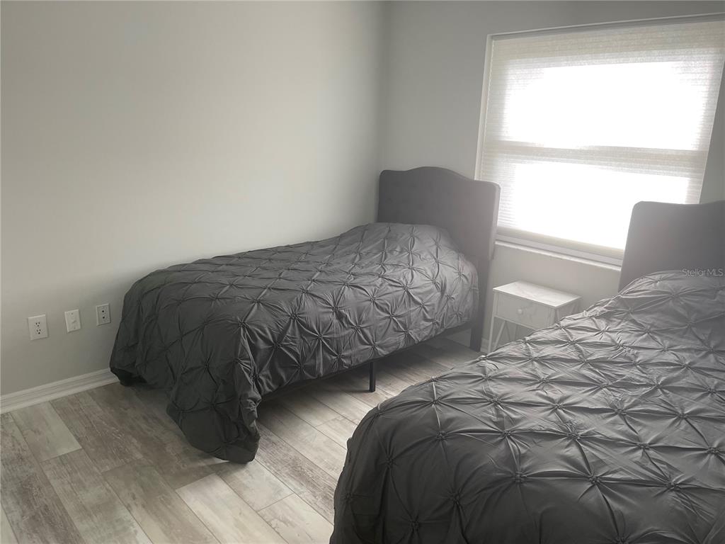21 Post View Drive Palm Coast, FL 32164 - Photo 15 of 28 a bedroom with a bed and a window