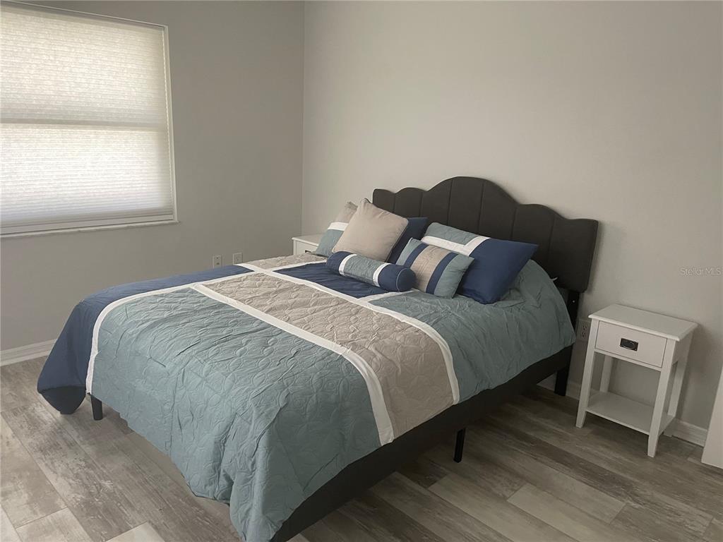 21 Post View Drive Palm Coast, FL 32164 - Photo 16 of 28 a bedroom with a bed and a window