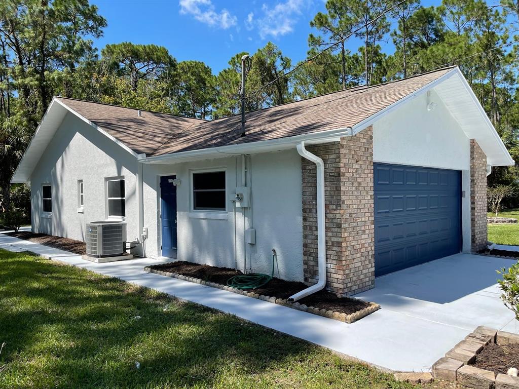 21 Post View Drive Palm Coast, FL 32164 - Photo 19 of 28 a house view with a backyard space