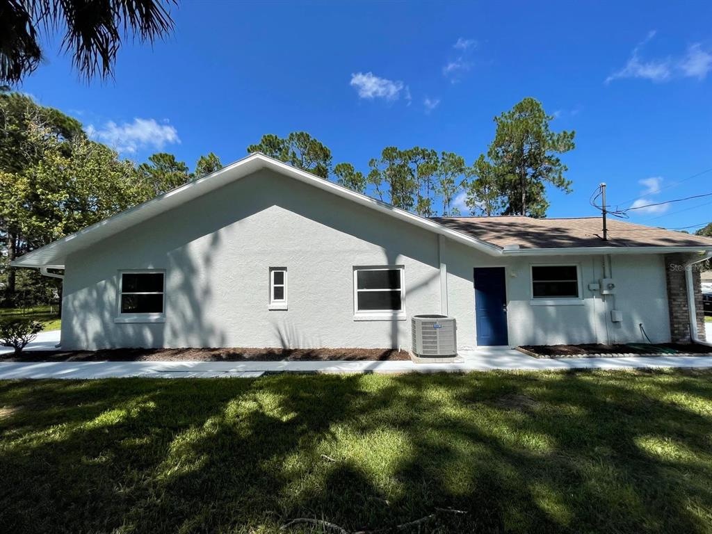 21 Post View Drive Palm Coast, FL 32164 - Photo 21 of 28 a front view of house with yard and green space