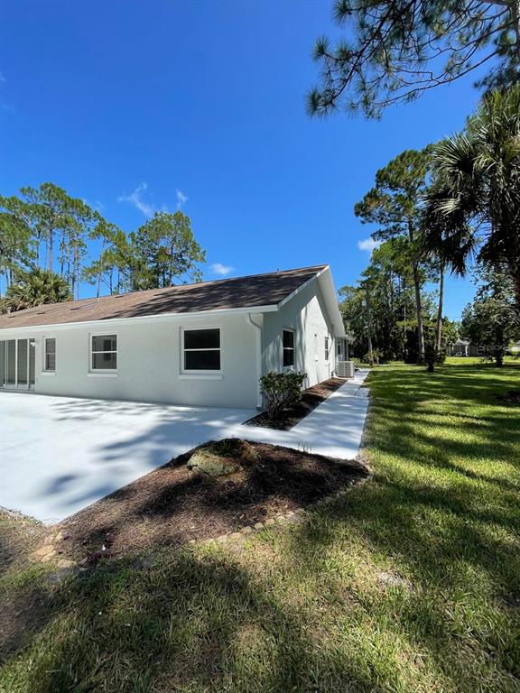 21 Post View Drive Palm Coast, FL 32164 - Photo 22 of 28 a view of a house with backyard and sitting area