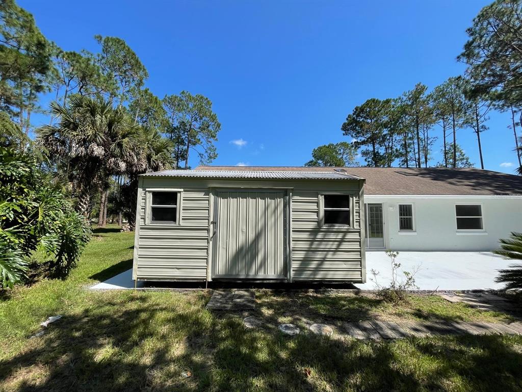 21 Post View Drive Palm Coast, FL 32164 - Photo 23 of 28 a front view of a house with a yard