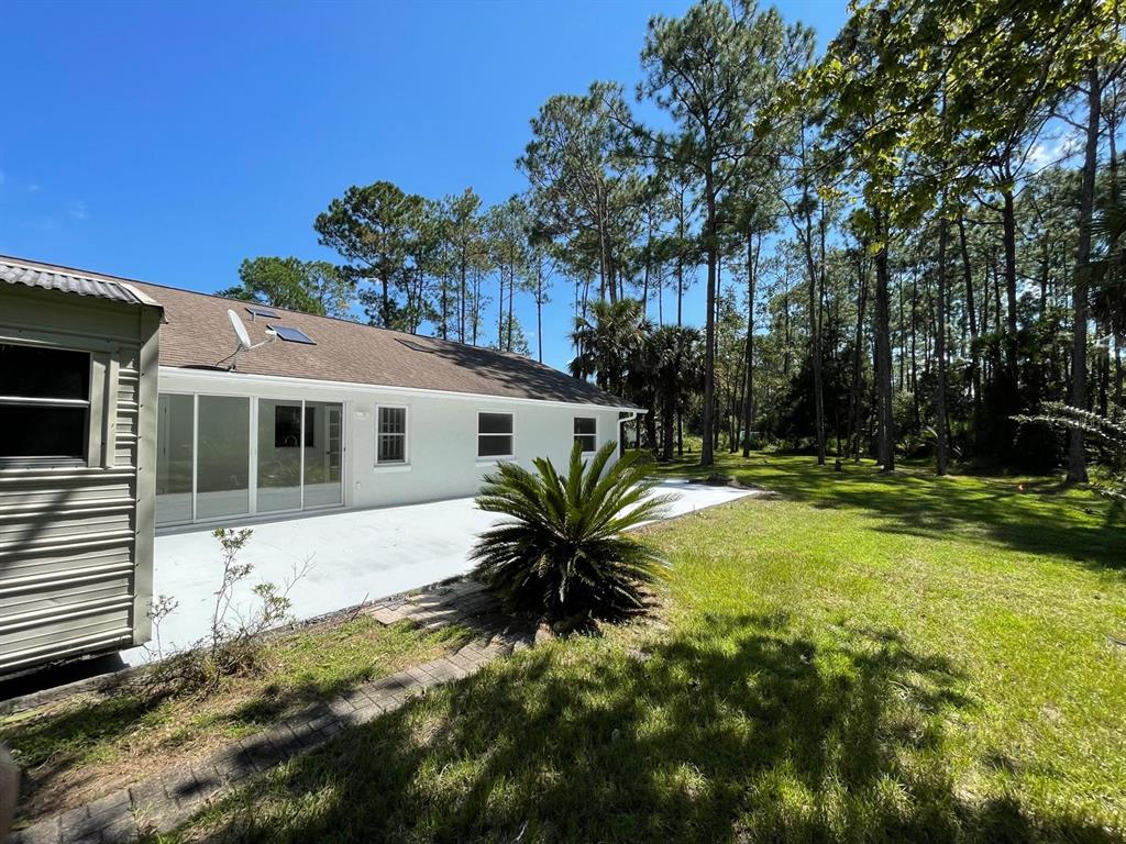 21 Post View Drive Palm Coast, FL 32164 - Photo 24 of 28 a view of a house with a yard