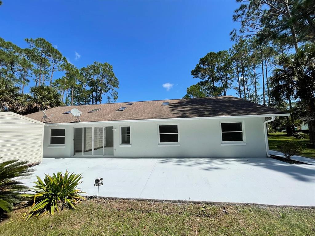 21 Post View Drive Palm Coast, FL 32164 - Photo 27 of 28 a front view of a house with a yard