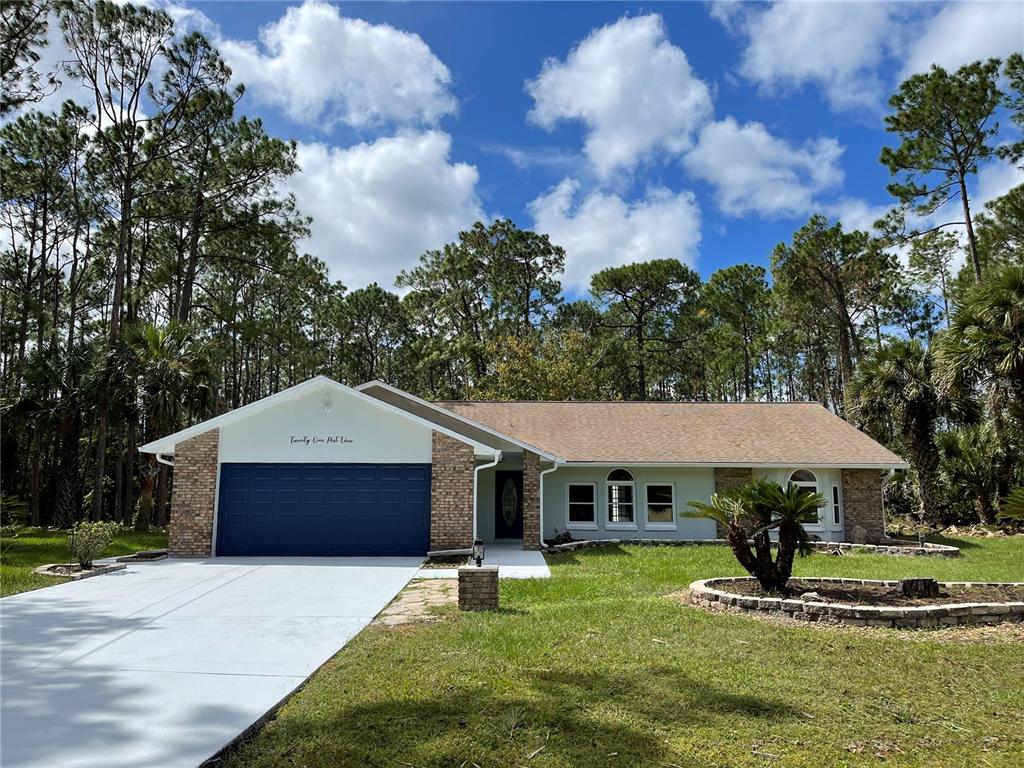 21 Post View Drive Palm Coast, FL 32164 - Photo 28 of 28 a house view with a garden space