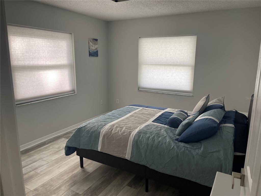 21 Post View Drive Palm Coast, FL 32164 - Photo 7 of 28 a bed sitting in a bedroom next to a window