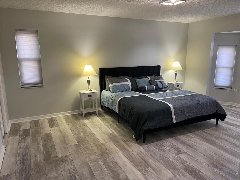 21 Post View Drive Palm Coast, FL 32164 - Photo 9 of 28 a bedroom with a bed and a night stand