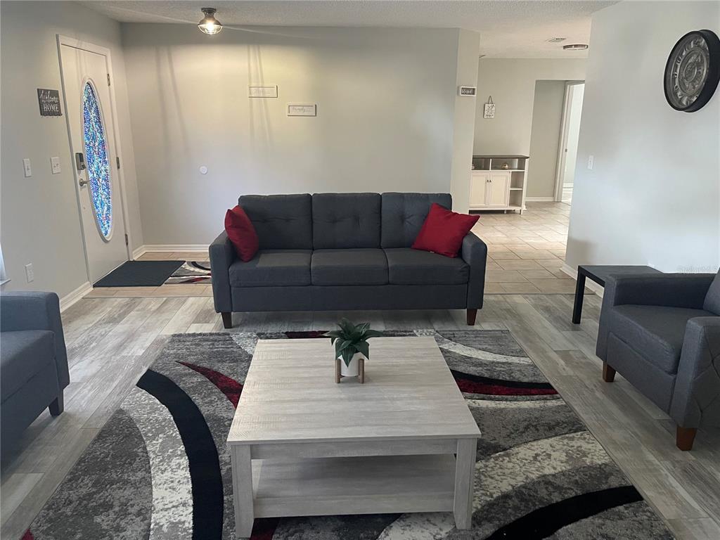 21 Post View Drive Palm Coast, FL 32164 - Photo 10 of 28 a living room with furniture and a couch