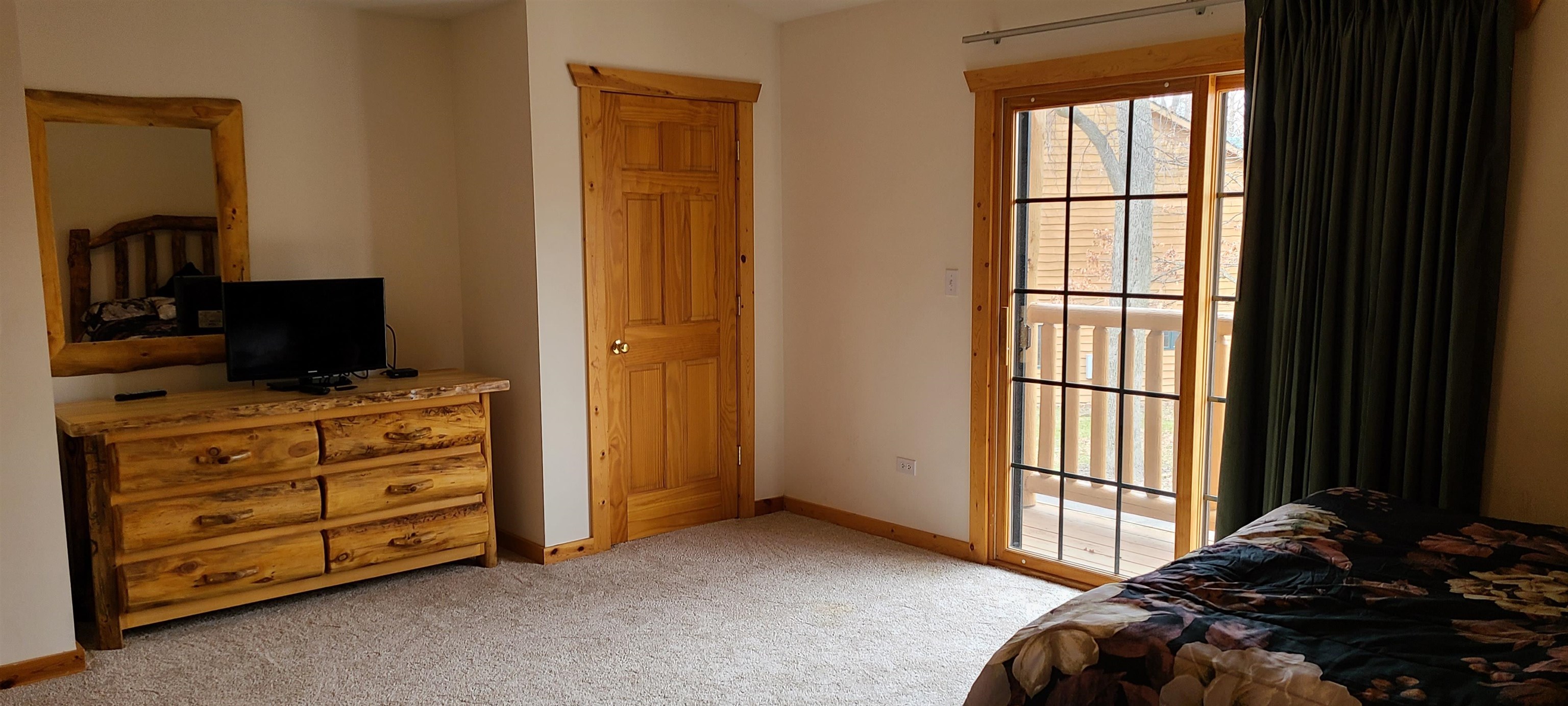 2643 Highway 178, Unit Q1 Utica, IL 61373 - Photo 16 of 21 a bedroom with a bed and a television