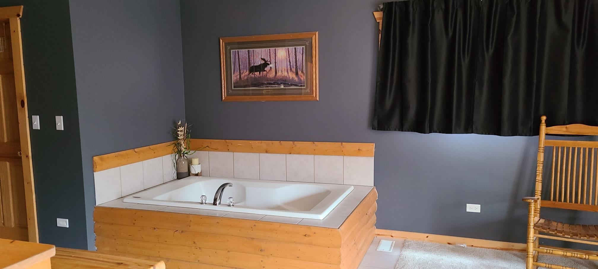 2643 Highway 178, Unit Q1 Utica, IL 61373 - Photo 17 of 21 a bathroom with a tub sink and vanity