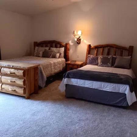 a spacious bedroom with a bed and a couch