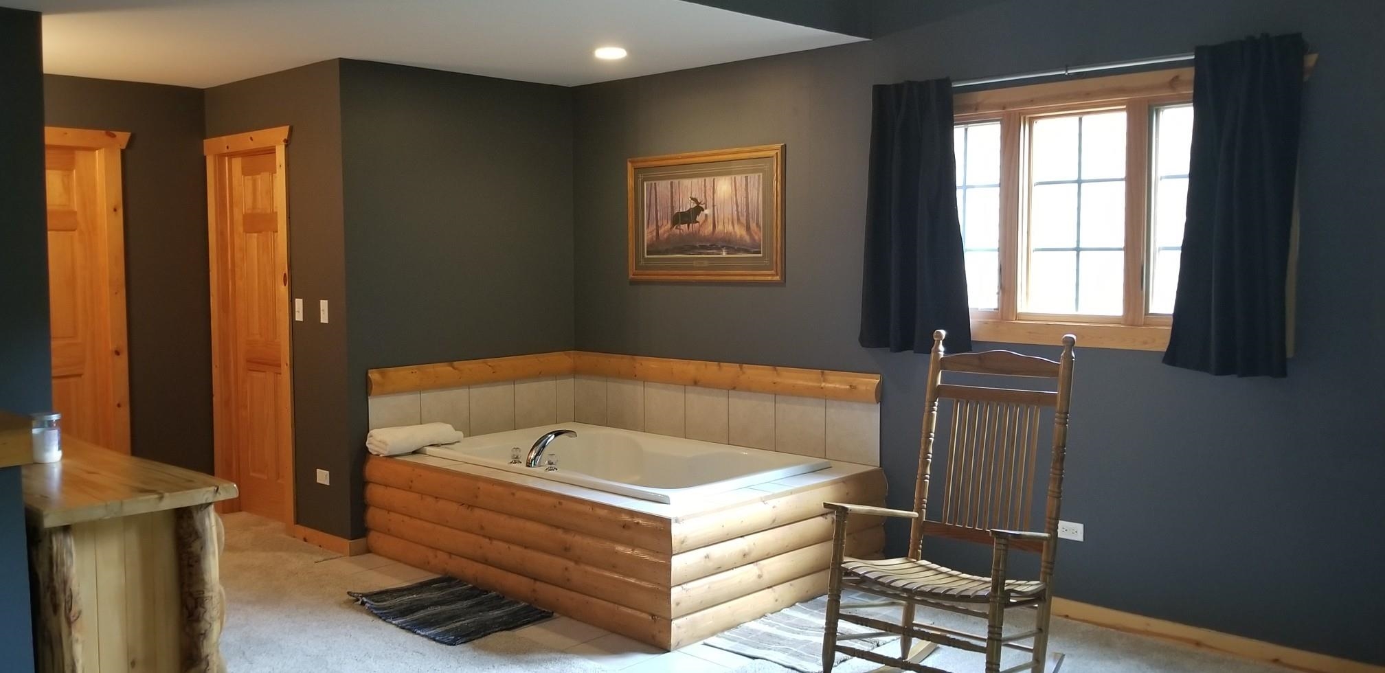 2643 Highway 178, Unit Q1 Utica, IL 61373 - Photo 9 of 21 a bathroom with a bathtub and a window