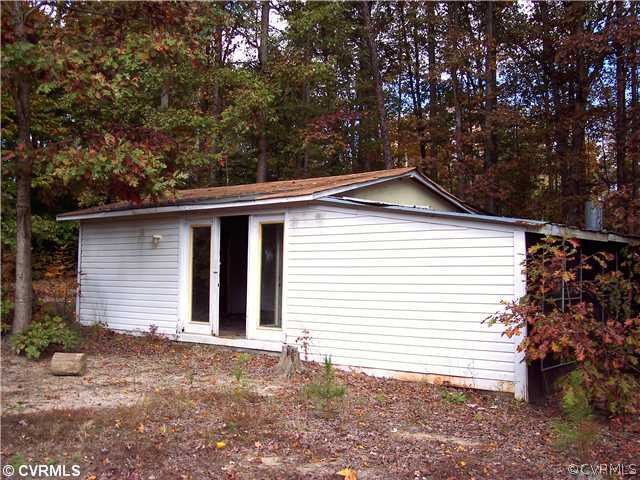 19811 Anderson Mill Road Beaverdam, VA 23015 - Photo 2 of 7 a front view of a house with a yard and garage