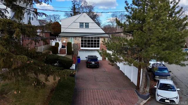 a view of a car park in front of house