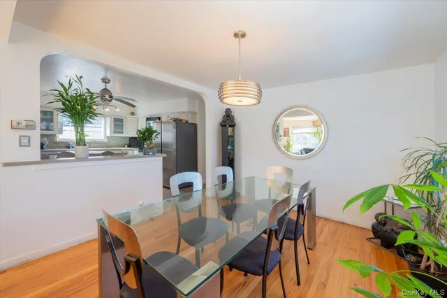 a view of a dining room with a table and chairs