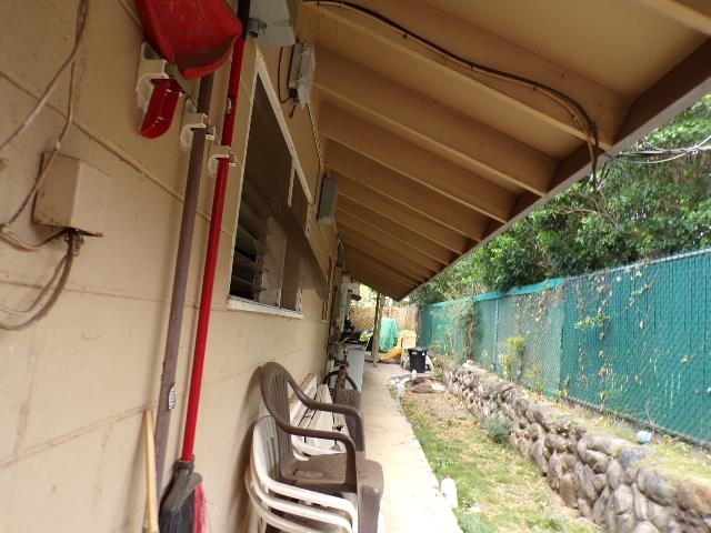 2259 Mokuhau Road Wailuku, HI 96793 - Photo 11 of 27 a view of balcony with wooden floor and seating space