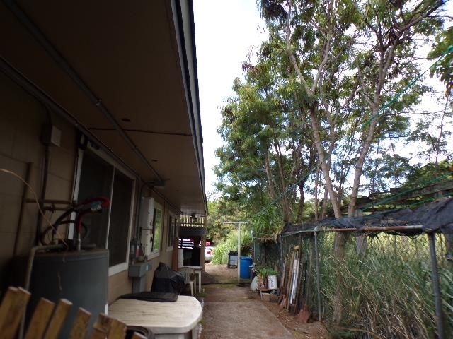2259 Mokuhau Road Wailuku, HI 96793 - Photo 12 of 27 a backyard of a house with lake view and outdoor seating