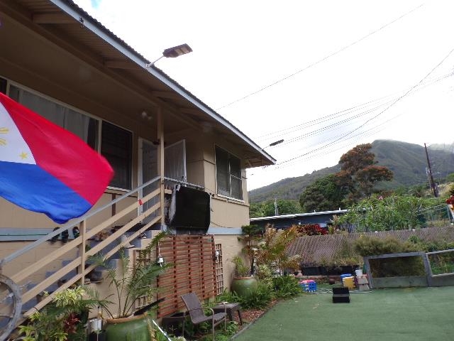 2259 Mokuhau Road Wailuku, HI 96793 - Photo 3 of 27 a backyard of a house with lots of green space