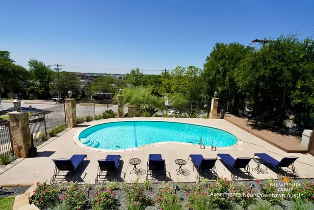an outdoor space with furniture and umbrella