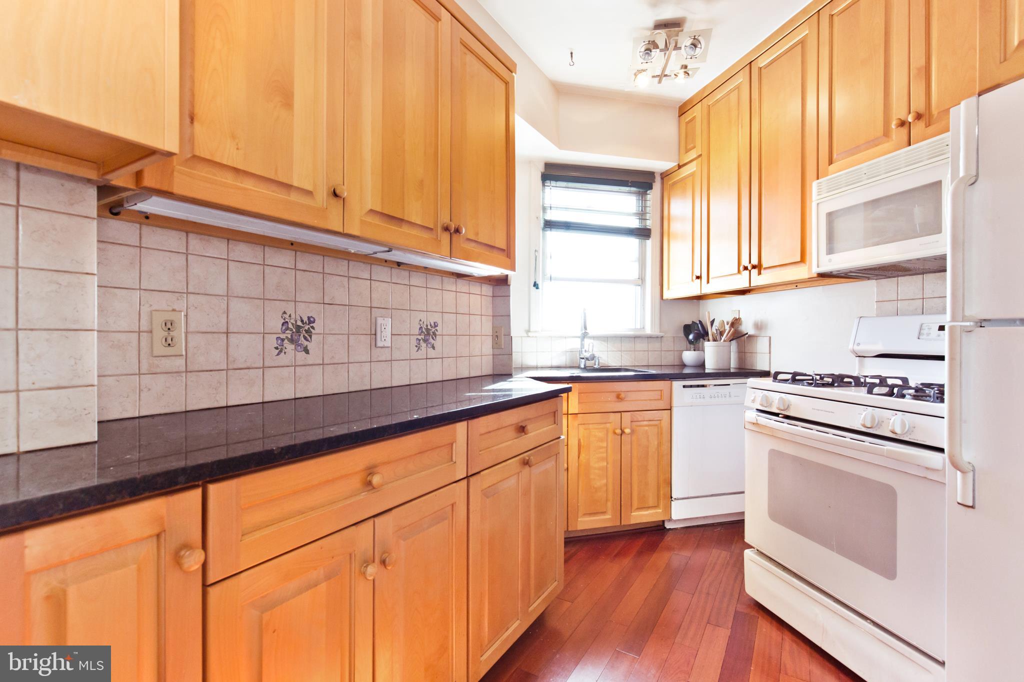 2500 Q Street Northwest, Unit 727 Washington, DC 20007 - Photo 15 of 42 Updated kitchen with Granite and Maple Cabinets