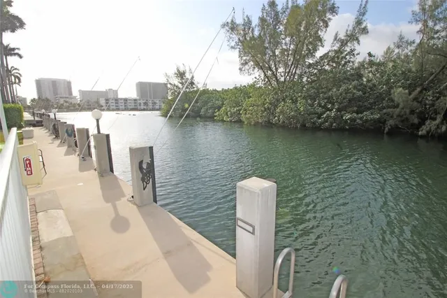 a view of a lake with a large building in the background