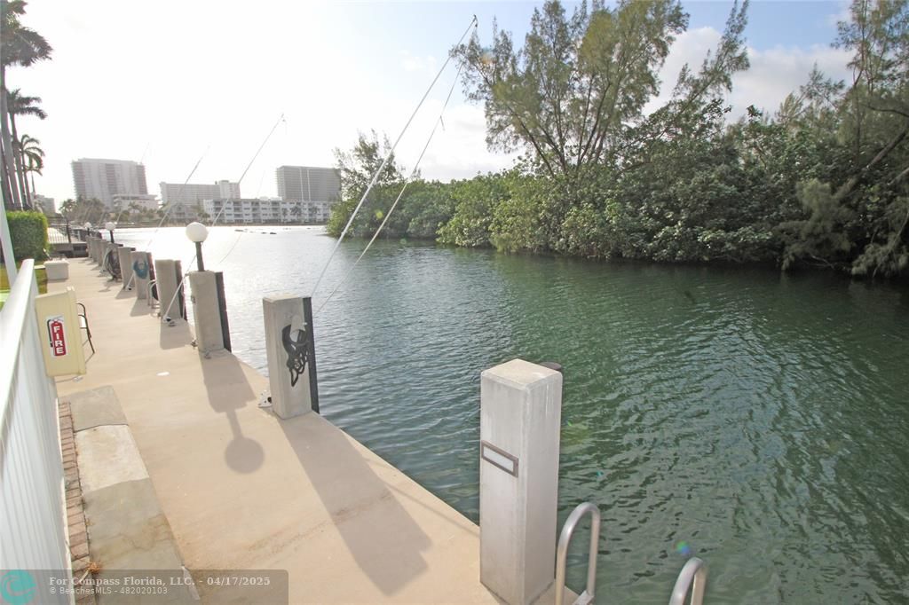 a view of a lake with a large building in the background