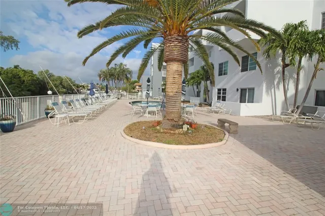 a view of a house with backyard and swimming pool